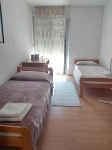 Postel nebo postele na pokoji v ubytování Apartment Mirela