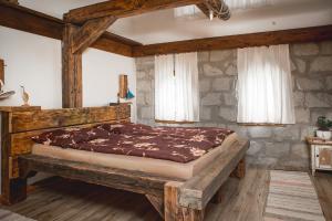 Posteľ alebo postele v izbe v ubytovaní Pajta Apartman