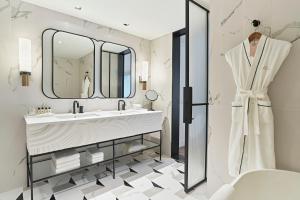 a bathroom with a sink and a mirror at Grand Josun Busan in Busan +55 photos