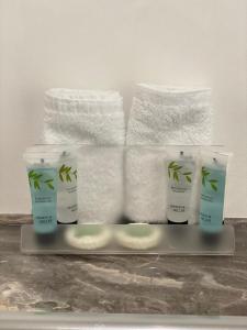 a group of four products on a tray with towels at The Station Hotel in Insch