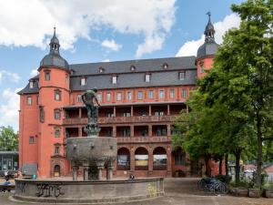 a large building with a statue in front of it at Holiday Inn Express - Offenbach by IHG in Offenbach
