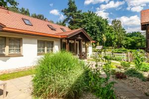 a garden in front of a house at Domek pod Grabami in Gdańsk