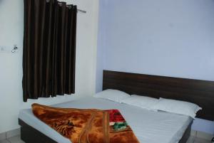 Letto o letti in una camera di Hotel Chouhan Paradise