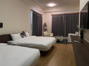 Ein Bett oder Betten in einem Zimmer der Unterkunft 澎湖日記 PenghuDiary