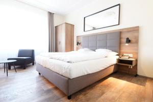 Postel nebo postele na pokoji v ubytování Hotel Bayerischer Hof