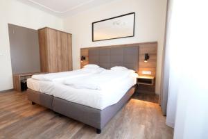 Postel nebo postele na pokoji v ubytování Hotel Bayerischer Hof