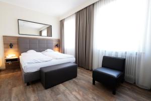 Postel nebo postele na pokoji v ubytování Hotel Bayerischer Hof
