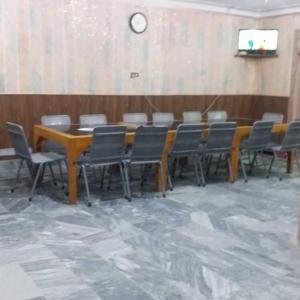 a conference room with a table and chairs in it at Hotel De Rose Wood Batakundi in Dumri
