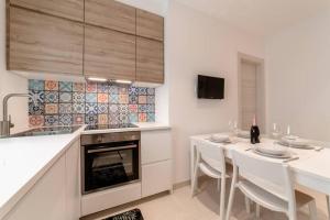 Η κουζίνα ή μικρή κουζίνα στο AmazHome - "La mia casa al mare" con parcheggio +10 φωτογραφίες