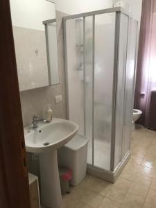 a bathroom with a sink and a shower at L'Alloggio Perfetto in Putignano