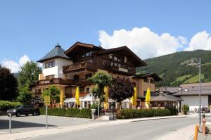 a large building on the side of a street at Sonnenschein Appartement Rebecca in Kirchberg in Tirol