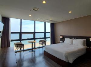 Postel nebo postele na pokoji v ubytování MS Hotel Haeundae
