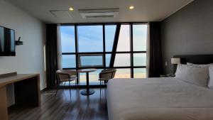 Postel nebo postele na pokoji v ubytování MS Hotel Haeundae