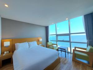 Postel nebo postele na pokoji v ubytování MS Hotel Haeundae