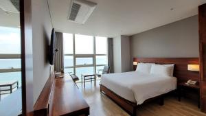 Postel nebo postele na pokoji v ubytování MS Hotel Haeundae
