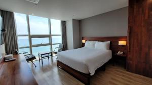 Postel nebo postele na pokoji v ubytování MS Hotel Haeundae