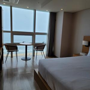 Postel nebo postele na pokoji v ubytování MS Hotel Haeundae