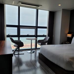 Postel nebo postele na pokoji v ubytování MS Hotel Haeundae