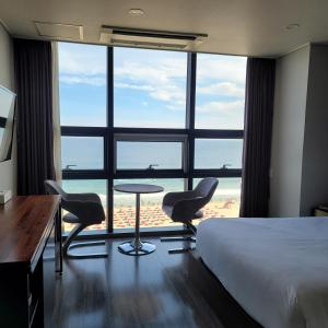 Postel nebo postele na pokoji v ubytování MS Hotel Haeundae