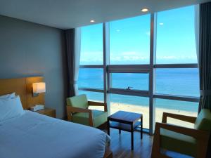Postel nebo postele na pokoji v ubytování MS Hotel Haeundae