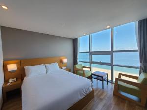 Postel nebo postele na pokoji v ubytování MS Hotel Haeundae