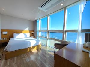 Postel nebo postele na pokoji v ubytování MS Hotel Haeundae