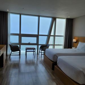 Postel nebo postele na pokoji v ubytování MS Hotel Haeundae