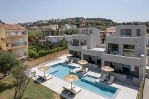 an aerial view of a building with a swimming pool at Casa Nostos in Agia Marina Nea Kydonias