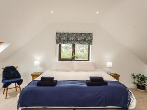 Postel nebo postele na pokoji v ubytování Bwthyn Cae Haidd