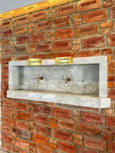 a brick wall with two shelves on it at Sunrise Aparts in Polyana +37 photos