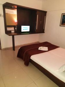 Postel nebo postele na pokoji v ubytování HOTEL S K PALACE