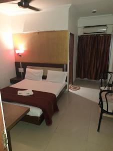 Postel nebo postele na pokoji v ubytování HOTEL S K PALACE