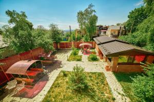 an overhead view of a garden with benches and a fence at Shato City in Nizhny Novgorod