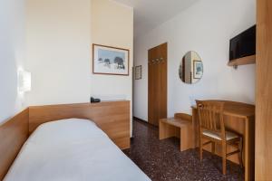 TV a/nebo společenská místnost v ubytování Hotel Roma
