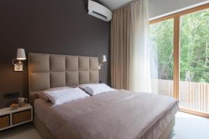 Postel nebo postele na pokoji v ubytování Villa Olea
