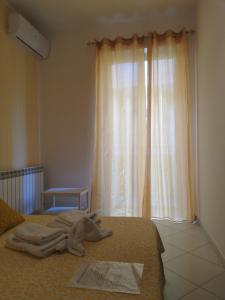 Postel nebo postele na pokoji v ubytování B&b regina del porto