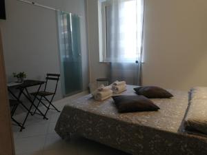 Postel nebo postele na pokoji v ubytování B&b regina del porto