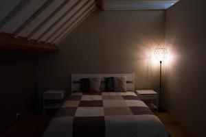 Säng eller sängar i ett rum på Glabbeek-hoeve