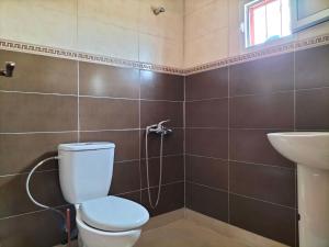 a bathroom with a toilet and a sink at Diafa Stay in Tangier