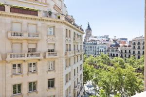 a tall building with balconies on the side of it at Stay U-nique Apartments Passeig de Gracia II in Barcelona