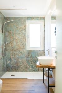 a bathroom with a sink and a window at Encanto Agriturismo & Private SPA in Visogliano