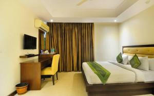 Postel nebo postele na pokoji v ubytování Zenith Hotel - Delhi Airport