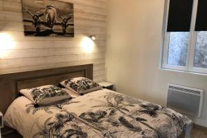a bedroom with a bed with two pillows on it at Laon : « Suite privée au pied de la Cathédrale » in Laon +43 photos