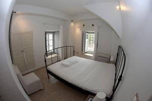a bedroom with a bed in a mirror at Relax & Enjoy in Spetses