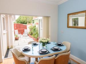 a dining room with a table and chairs at The Headlands - Gower in The Mumbles