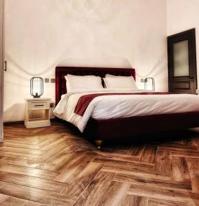 Postel nebo postele na pokoji v ubytování Casa Reale Boutique Hotel
