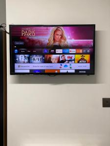 a flat screen tv hanging on a wall at Bvapartments-Queensgate in Huddersfield