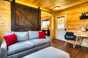 a living room with a couch and a wooden wall at The Base Camp in Spokane