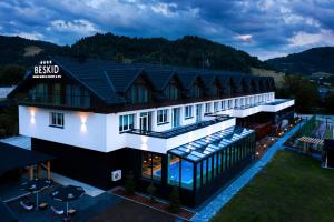 an aerial view of the resort with a swimming pool at BESKID **** Balneo Medical Resort & SPA in Piwniczna-Zdrój