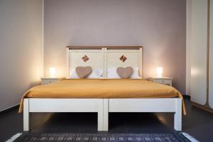A bed or beds in a room at Affittacamere La Piazzetta